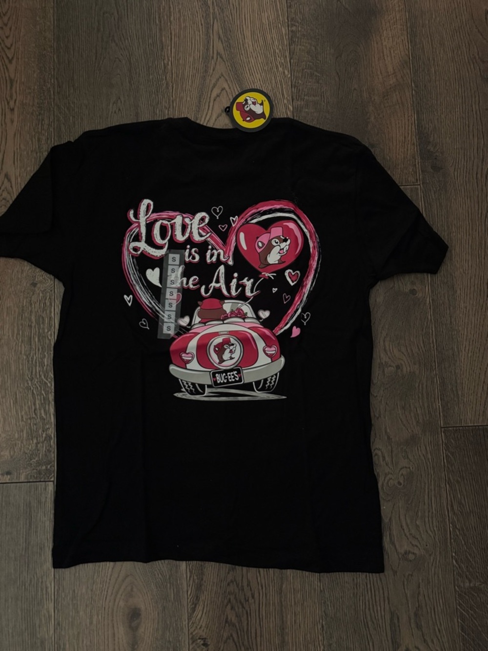 Buc-Ed’s Valentine Love Is In The Air Black Graphic Tee Size Small NWT